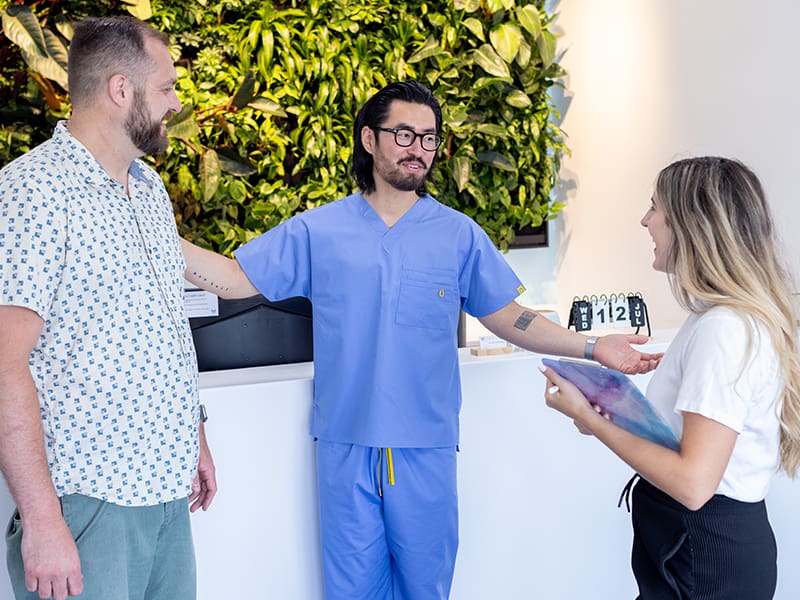 Dr. Kim speaking to patients